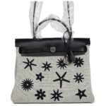 HERMÈS HERBAG ZIP 31 PM HOBNAILED BLACK AND ECRU PRINTED H PLUME CANVAS AND VACHE HUNTER PALLADIUM HARDWARE