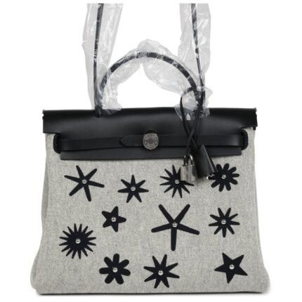 HERMÈS HERBAG ZIP 31 PM HOBNAILED BLACK AND ECRU PRINTED H PLUME CANVAS AND VACHE HUNTER PALLADIUM HARDWARE