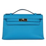 PRE-OWNED HERMÈS KELLY POCHETTE BLEU FRIDA SWIFT GOLD HARDWARE