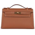 HERMÈS KELLY POCHETTE GOLD SWIFT GOLD HARDWARE