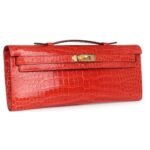 HERMÈS KELLY CUT ORANGE POPPY SHINY POROSUS CROCODILE GOLD HARDWARE