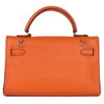 PRE-OWNED HERMÈS MICRO KELLY 15 ORANGE SWIFT PALLADIUM HARDWARE