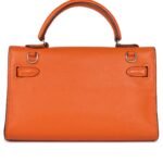 PRE-OWNED HERMÈS MICRO KELLY 15 ORANGE SWIFT PALLADIUM HARDWARE