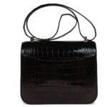 PRE-OWNED HERMÈS CONSTANCE 24 BLACK SHINY ALLIGATOR ROSE GOLD HARDWARE