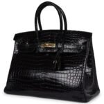 PRE-OWNED HERMÈS BIRKIN 35 BLACK SHINY POROSUS CROCODILE GOLD HARDWARE