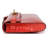 HERMÈS KELLY CUT ORANGE POPPY SHINY POROSUS CROCODILE GOLD HARDWARE