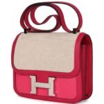 PRE-OWNED HERMÈS CONSTANCE 24 ROSE SHOCKING AND ECRU TOILE H BERLINE AND FRAMBOISE SWIFT PALLADIUM HARDWARE