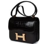 PRE-OWNED HERMÈS CONSTANCE 24 BLACK SHINY ALLIGATOR ROSE GOLD HARDWARE