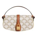 CELINE CLUTCH ON STRAP TABOU IN TRIOMPHE CANVAS AND CALFSKIN TAN